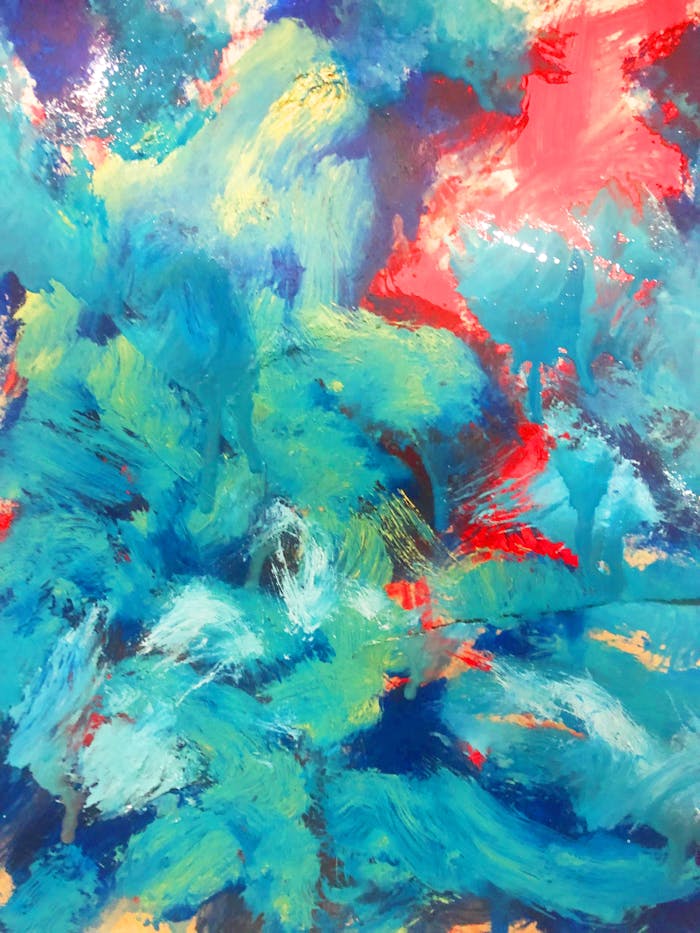 Dynamic abstract painting featuring vivid blues, reds, and greens, emphasizing texture and motion.